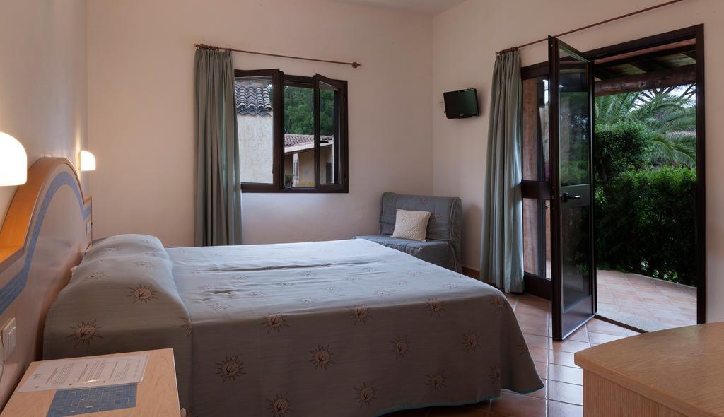 קניגיונה Centro Vacanze Isuledda חדר תמונה
